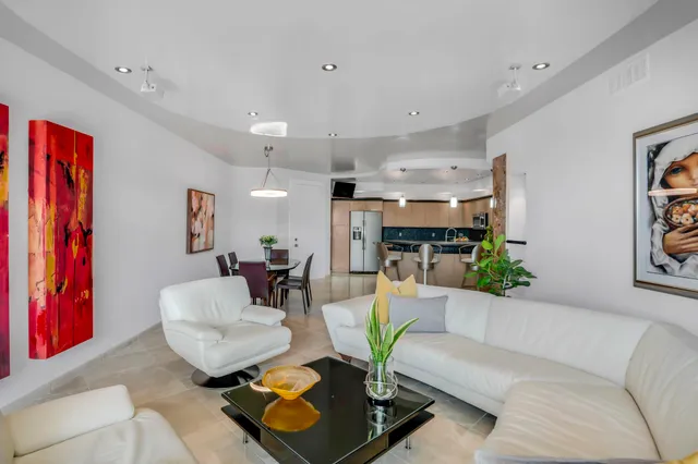 a room with a potted plant and a fireplace