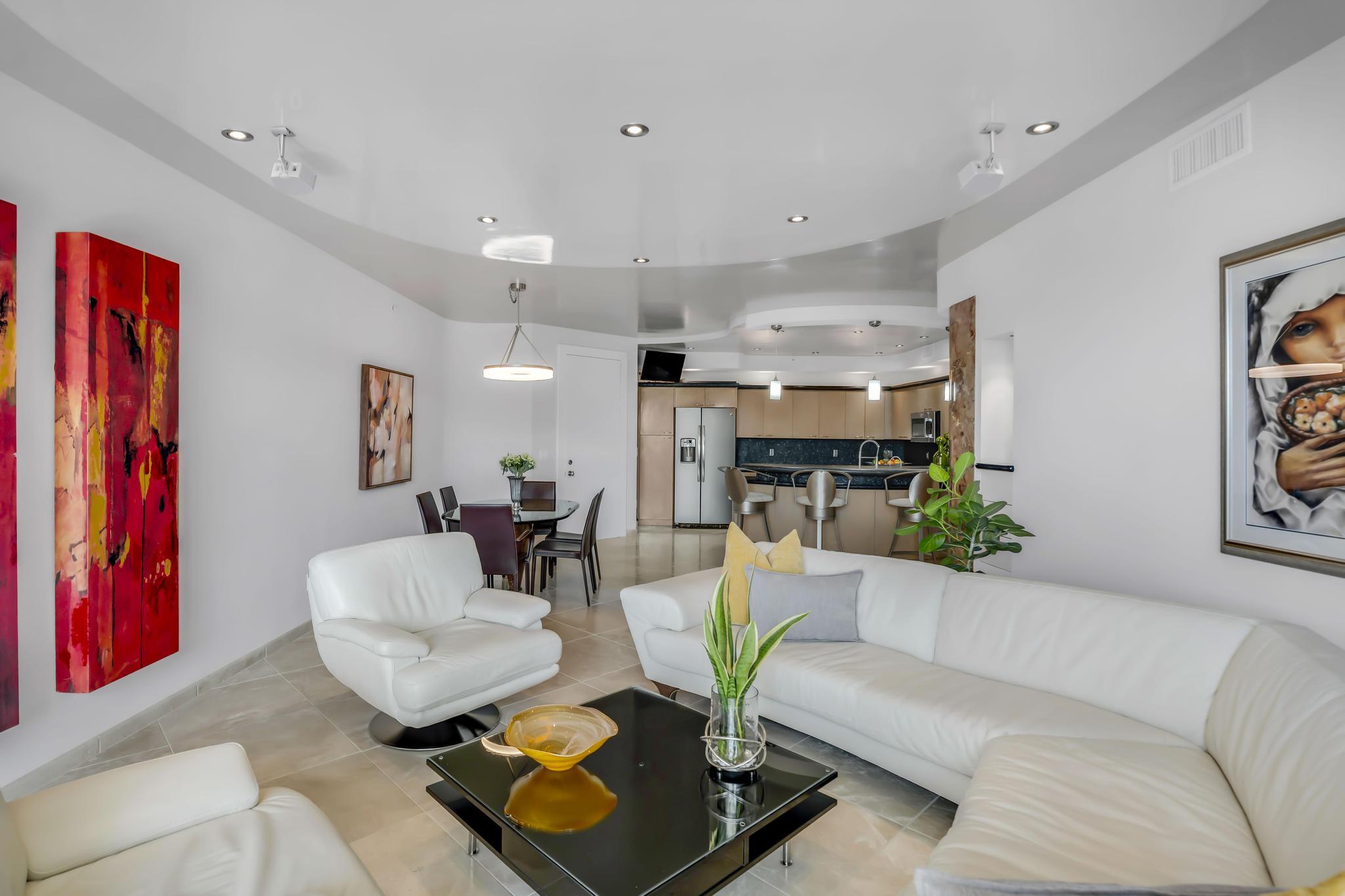 233 South Federal Highway, Unit 709 Boca Raton, FL 33432 - Photo 12 of 64 a living room with furniture and a flat screen tv