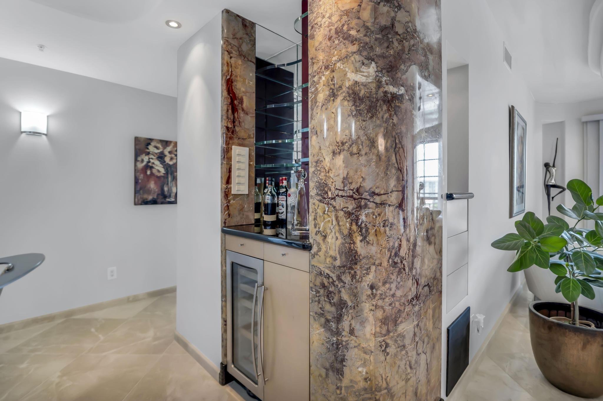 233 South Federal Highway, Unit 709 Boca Raton, FL 33432 - Photo 14 of 64 a room with a potted plant and a fireplace