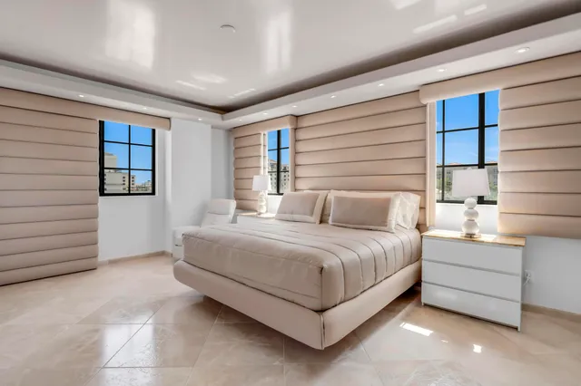 a bedroom with a bed and a couch