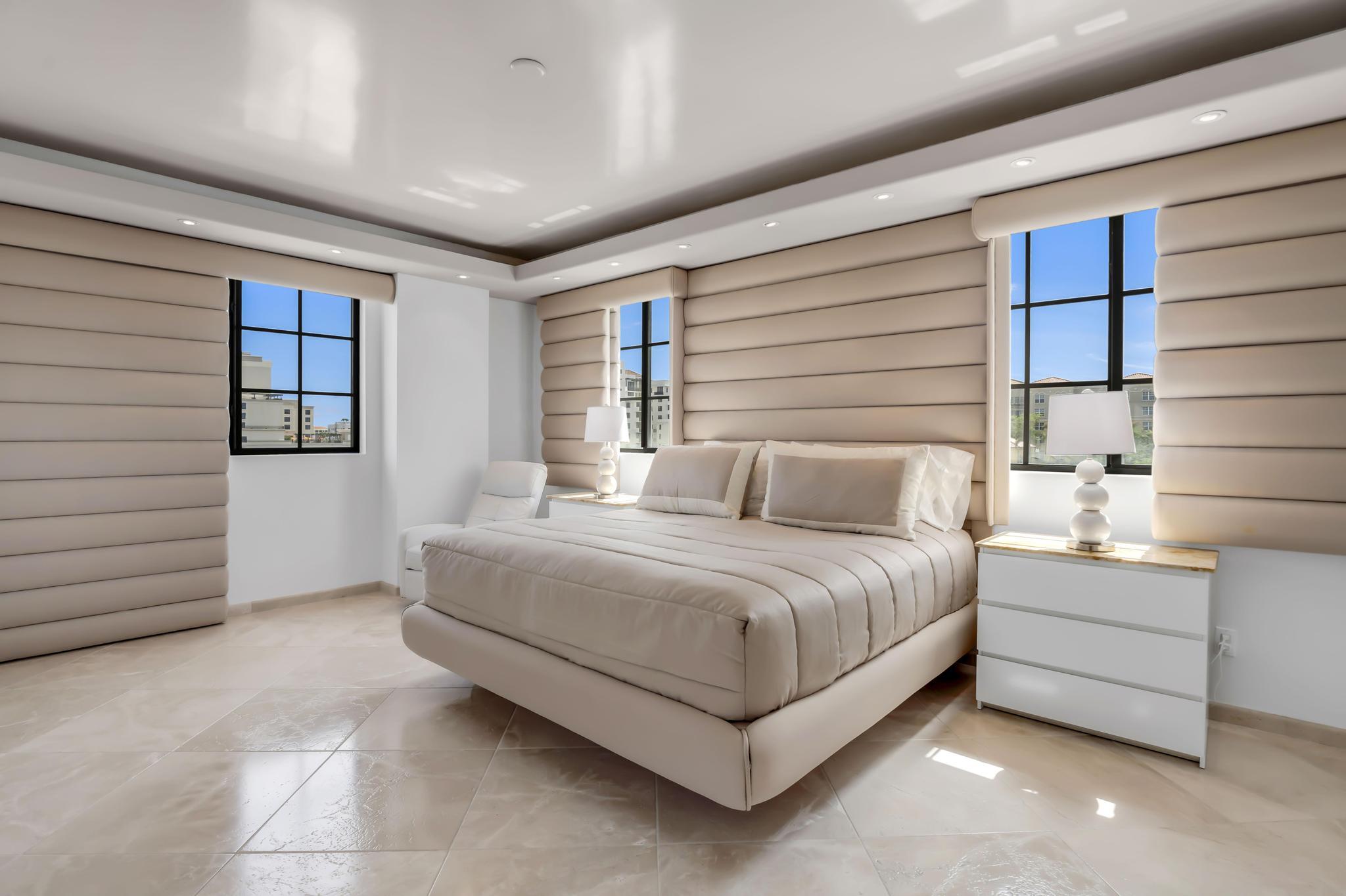 233 South Federal Highway, Unit 709 Boca Raton, FL 33432 - Photo 15 of 64 a spacious bedroom with a bed and a window