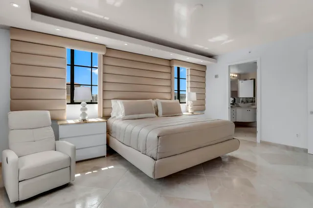 a spacious bathroom with a double vanity sink toilet and shower