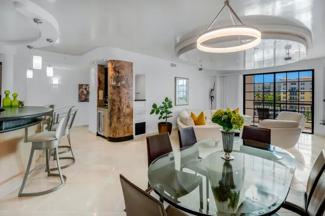 a view of a dining room with furniture wooden floor and chandelier