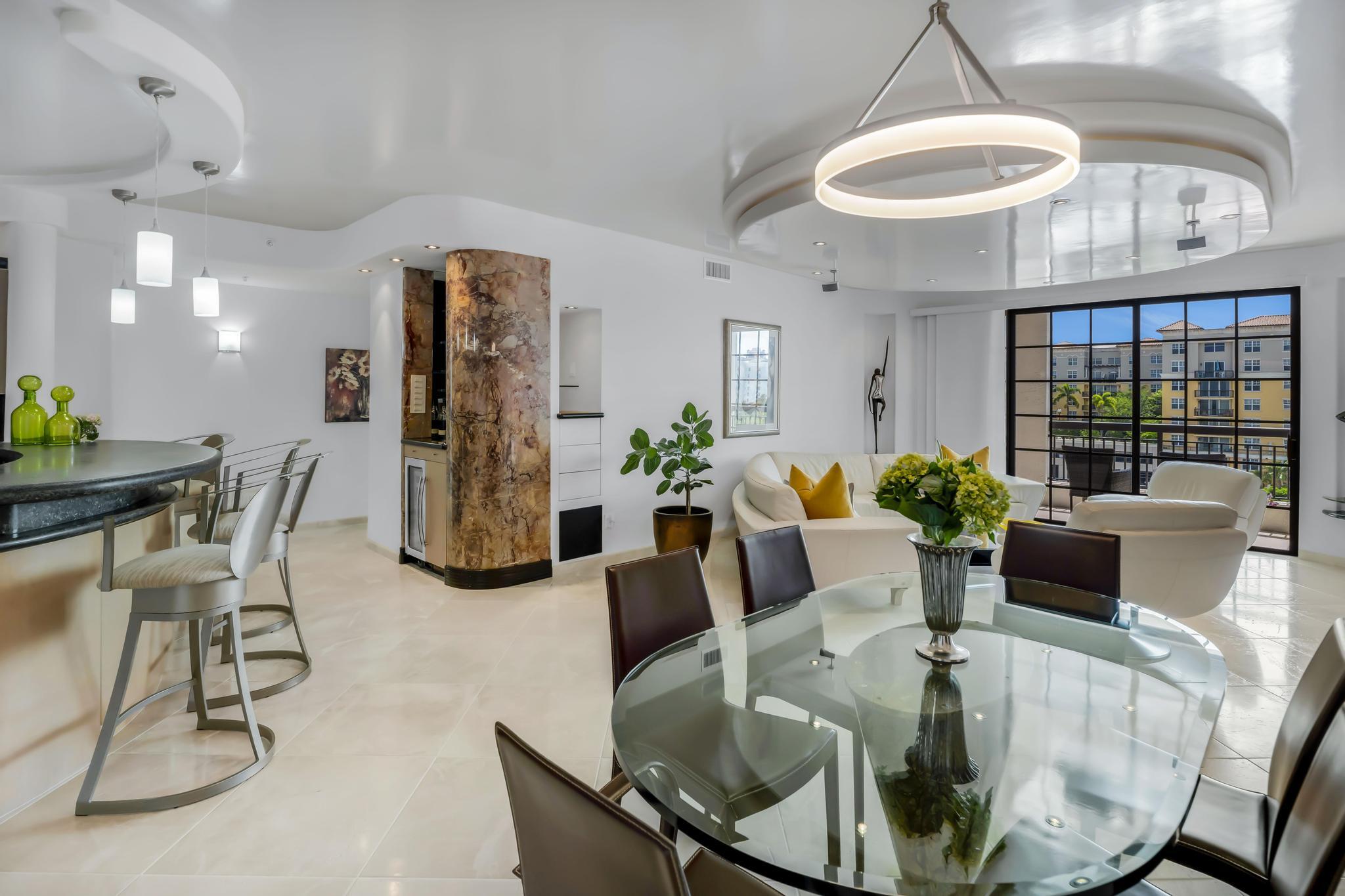 233 South Federal Highway, Unit 709 Boca Raton, FL 33432 - Photo 2 of 64 a view of a dining room with furniture wooden floor and chandelier