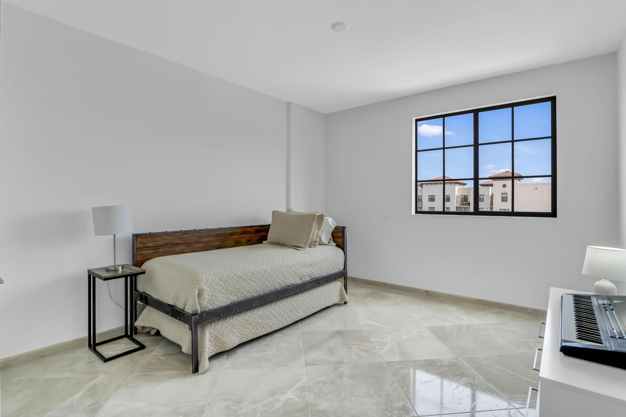 233 South Federal Highway, Unit 709 Boca Raton, FL 33432 - Photo 22 of 64 a bedroom with a bed and a window