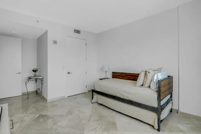 a bathroom with a walk in closet and a bathroom