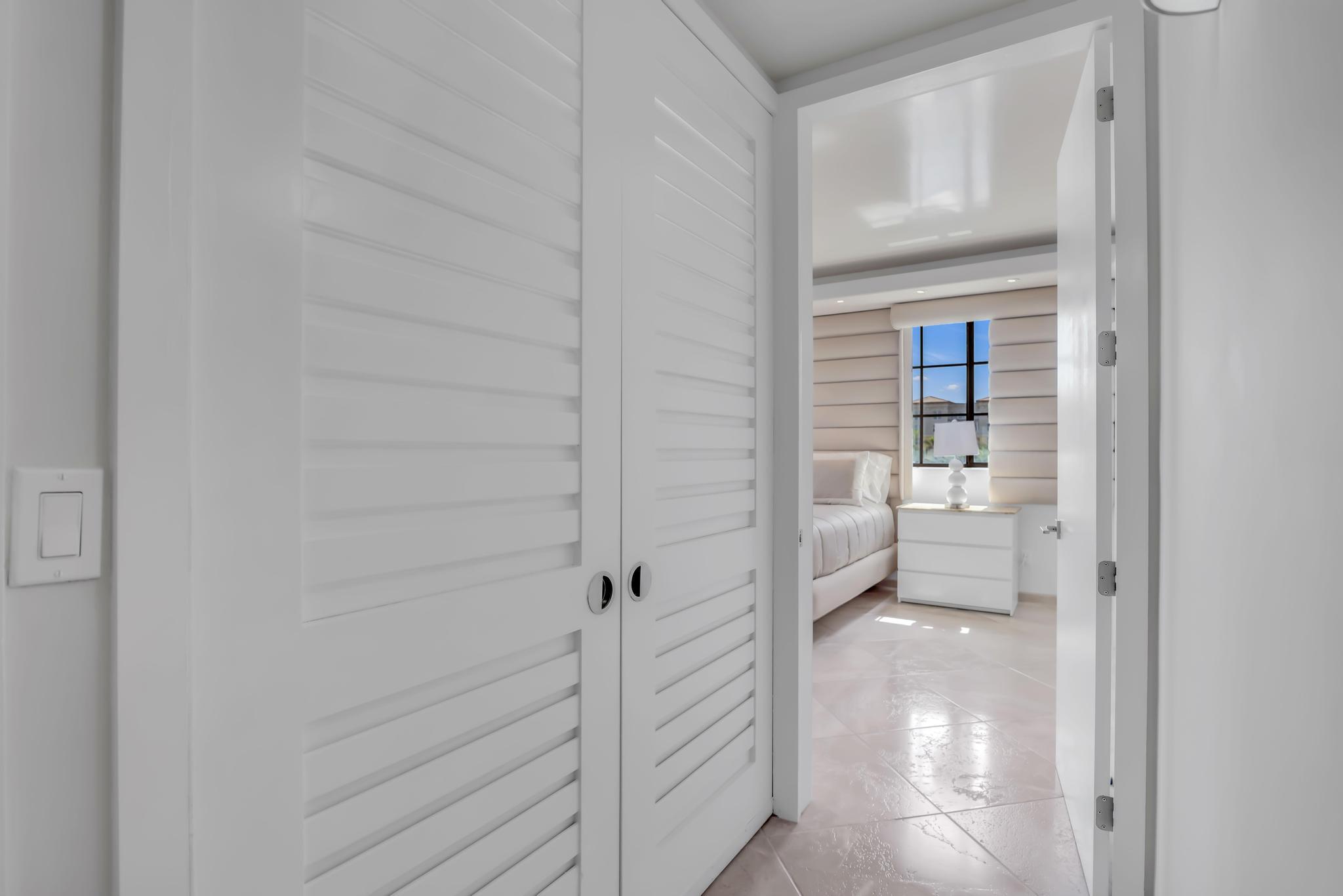 233 South Federal Highway, Unit 709 Boca Raton, FL 33432 - Photo 26 of 64 a bathroom with a walk in closet and a bathroom