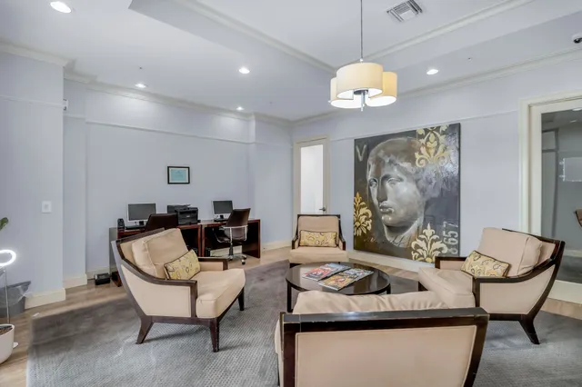 a view of a swimming pool with outdoor seating and a yard