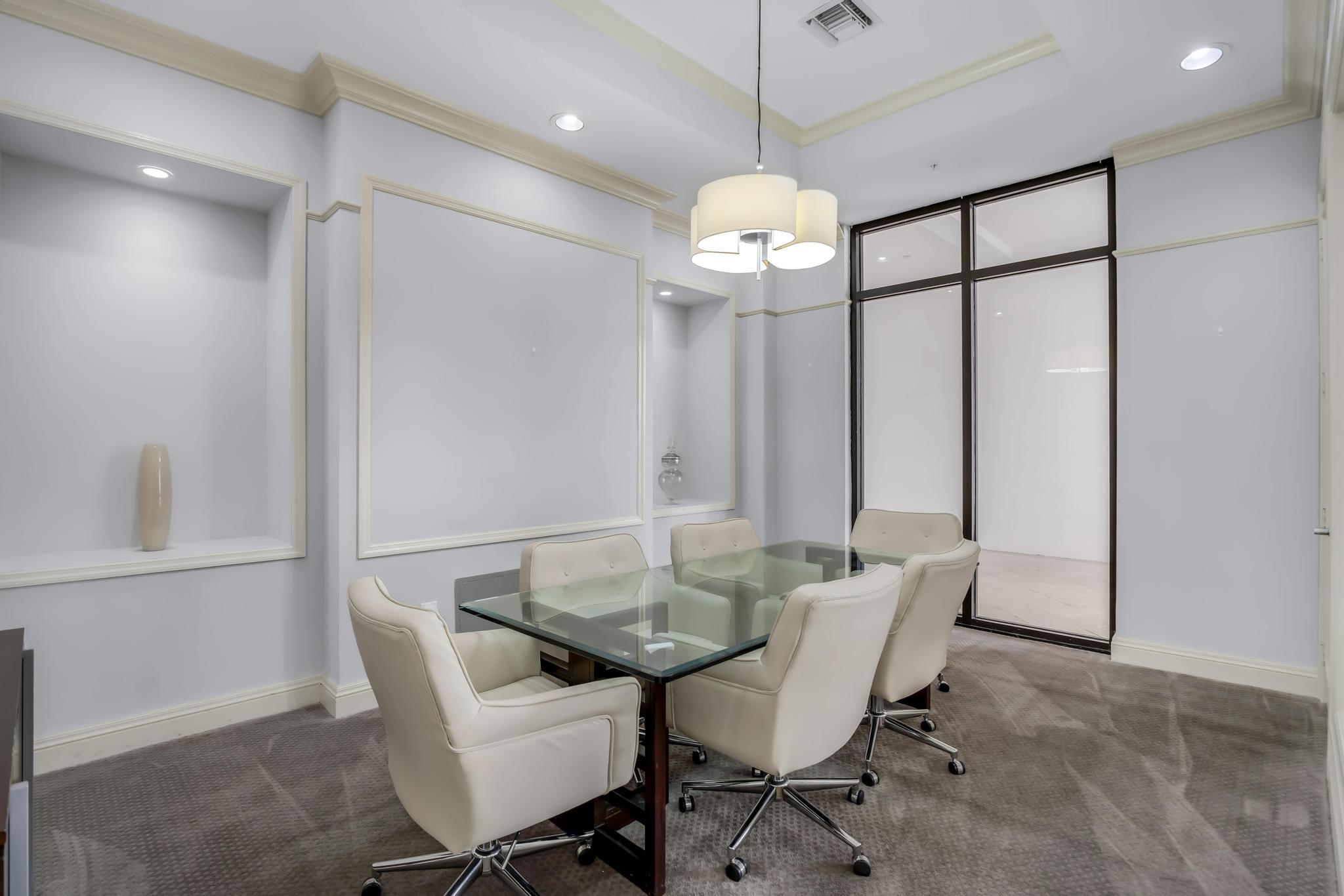 233 South Federal Highway, Unit 709 Boca Raton, FL 33432 - Photo 41 of 64 a view of a dining room with furniture wooden floor and chandelier