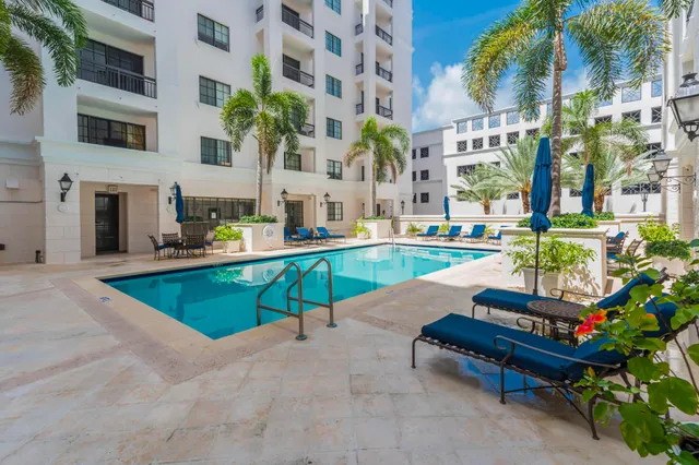 a view of living room with furniture and a chandelier