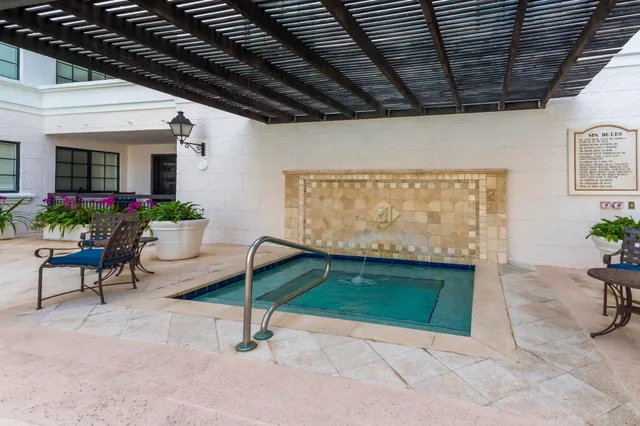 a view of a hallway with wooden shelves