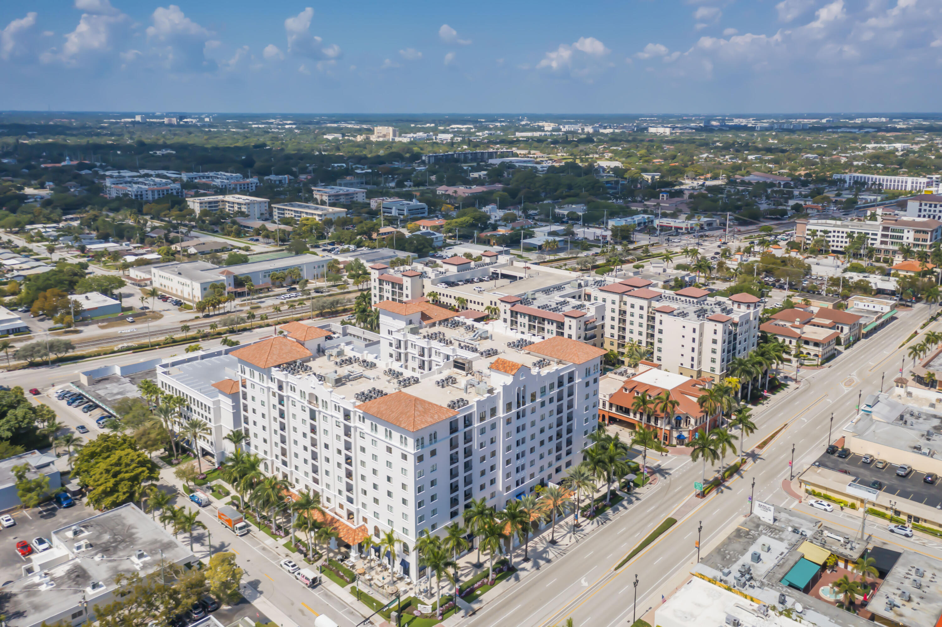 233 South Federal Highway, Unit 709 Boca Raton, FL 33432 - Photo 58 of 64 an aerial view of a city with lots of residential buildings ocean and mountain view in back