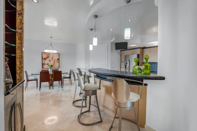a view of a hallway with furniture and window