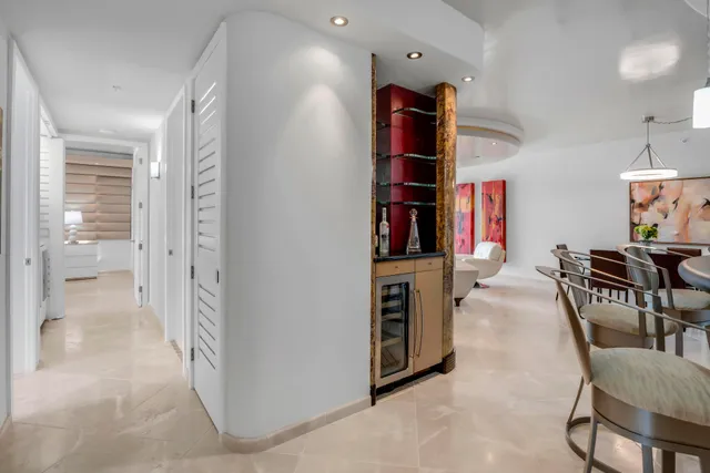 a kitchen with stainless steel appliances kitchen island granite countertop a sink and cabinets