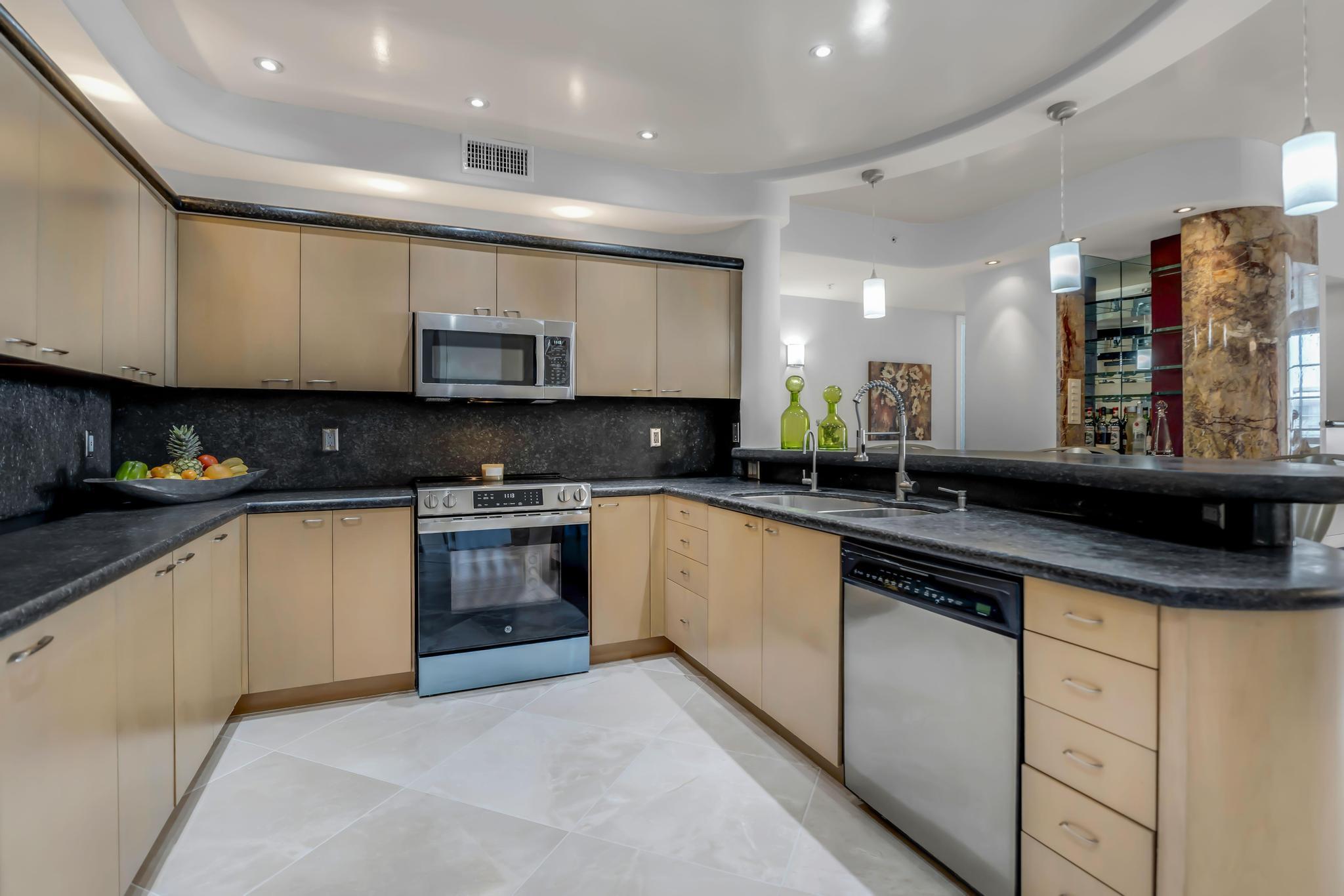 233 South Federal Highway, Unit 709 Boca Raton, FL 33432 - Photo 9 of 64 a kitchen with stainless steel appliances granite countertop a sink and cabinets
