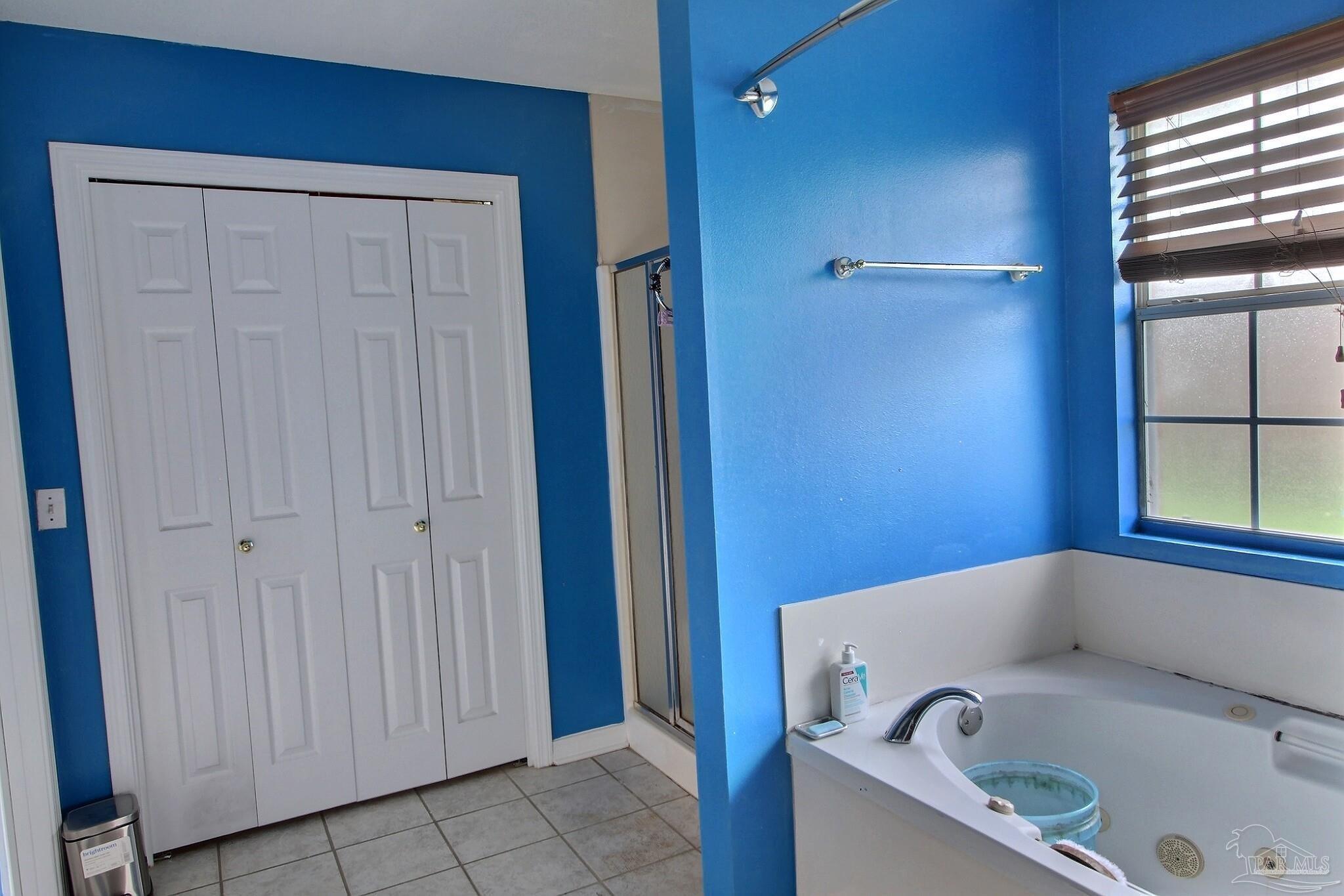 213 Newberry Street Cantonment, FL 32533 - Photo 15 of 23 a bathroom with a tub and shower