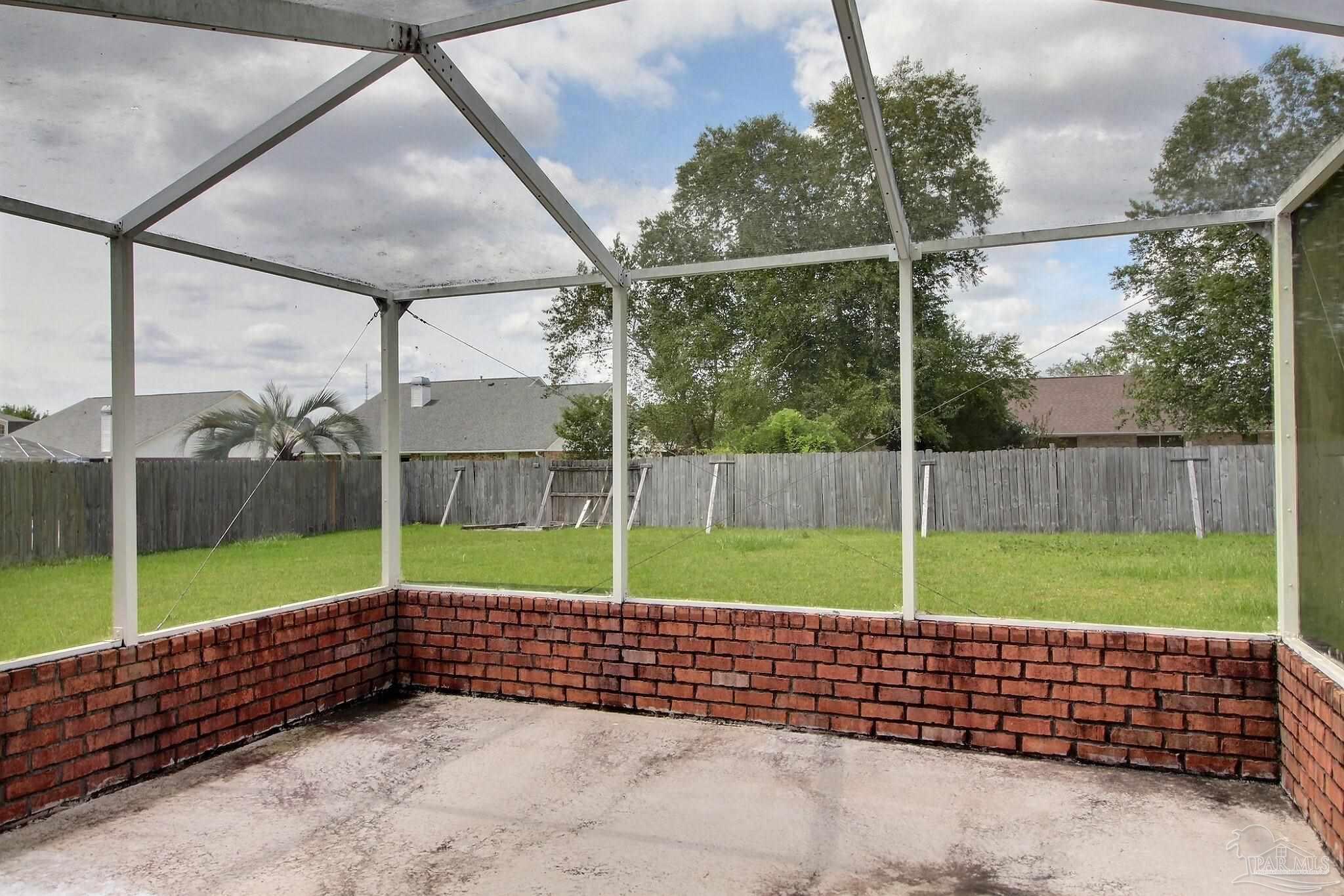 213 Newberry Street Cantonment, FL 32533 - Photo 19 of 23 a view of a backyard