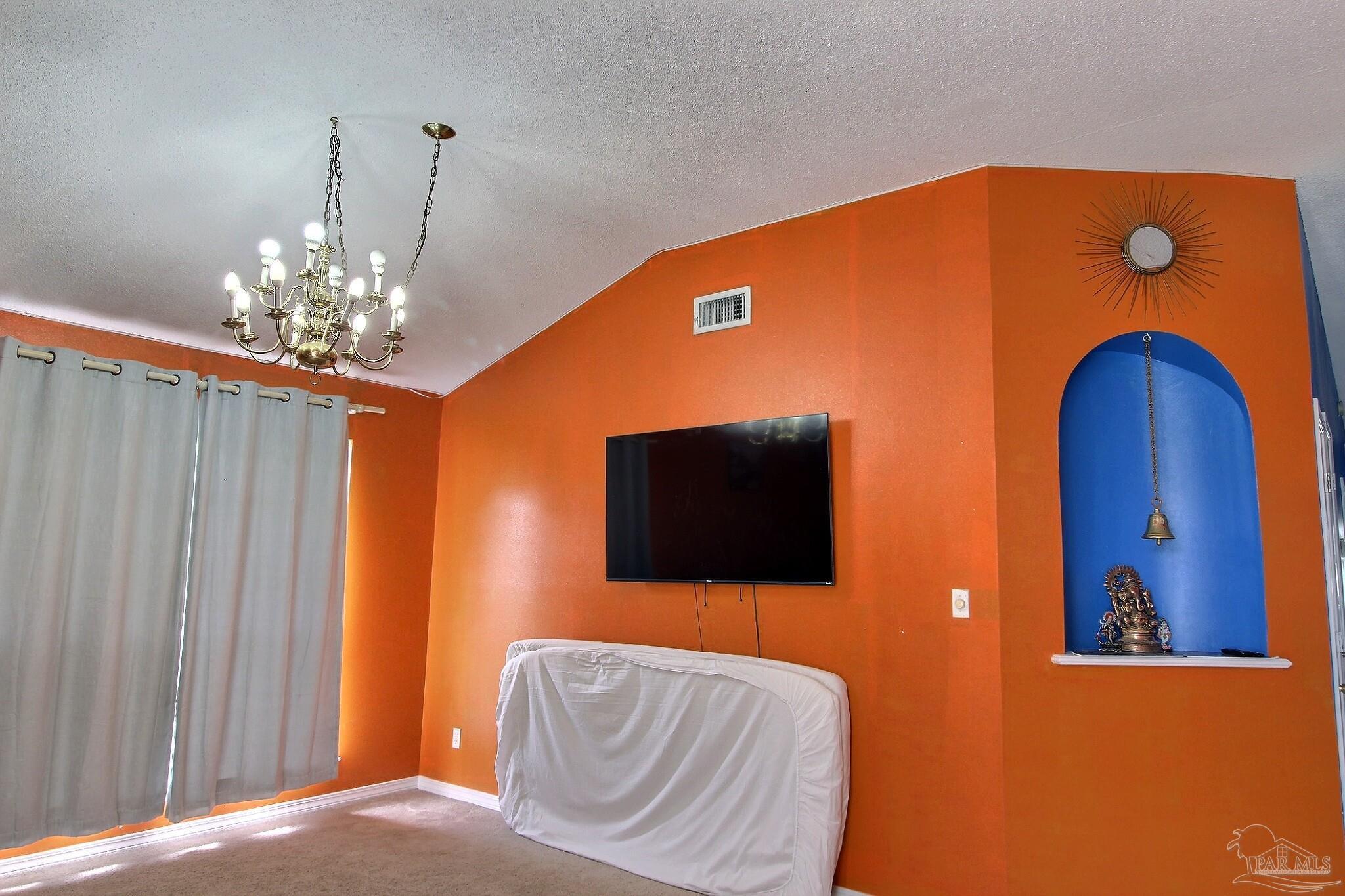 213 Newberry Street Cantonment, FL 32533 - Photo 21 of 23 a living room with furniture and a flat screen tv