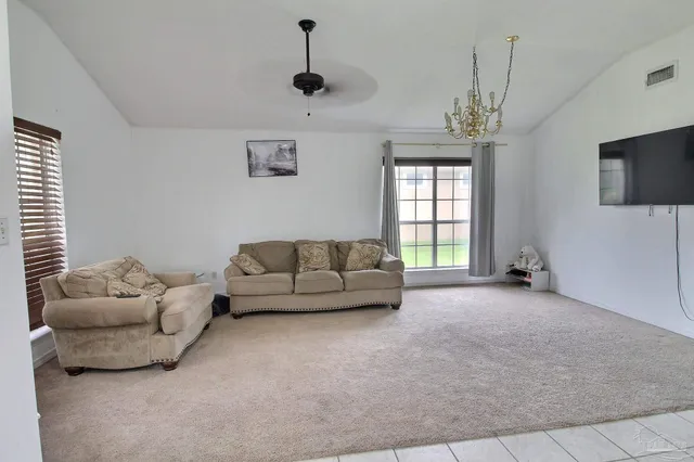 a living room with furniture and a window