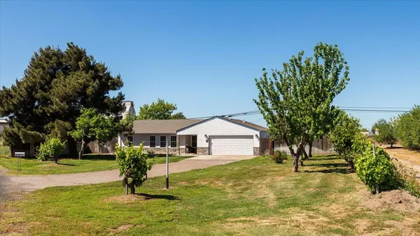 a house view with a garden space