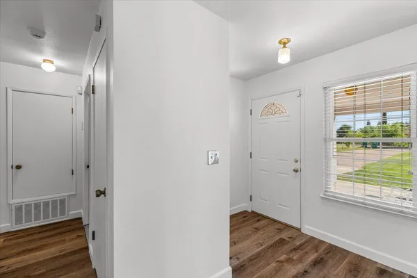 a room with a bed and a chandelier