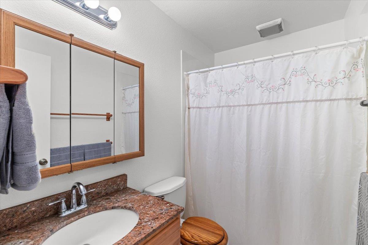 185 East Wyman Road French Camp, CA 95231 - Photo 26 of 44 a bathroom with a sink and a mirror