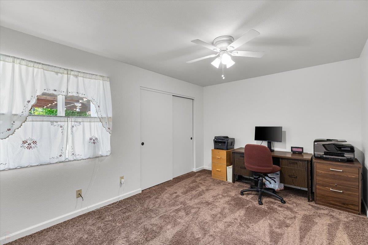 185 East Wyman Road French Camp, CA 95231 - Photo 27 of 44 a workspace with wooden floor and a window