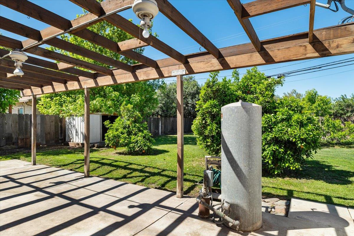 185 East Wyman Road French Camp, CA 95231 - Photo 38 of 44 a view of a patio with table and chairs and wooden floor