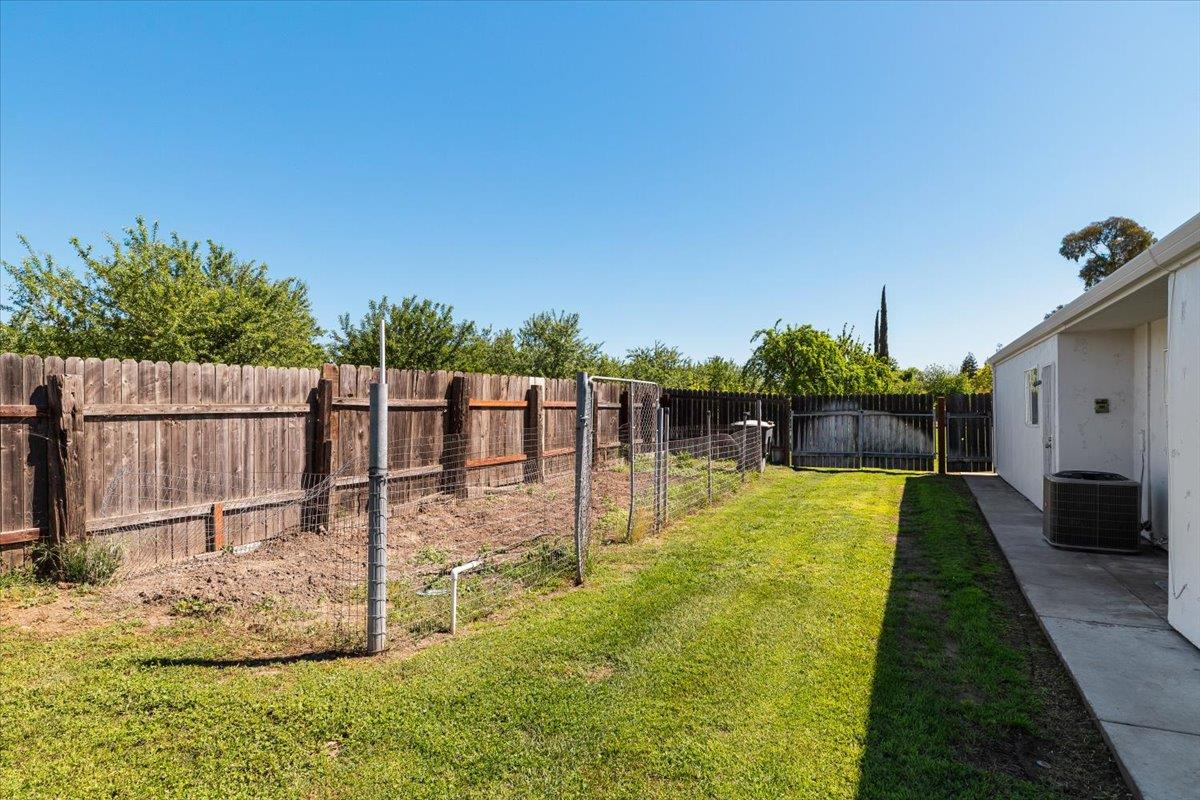 185 East Wyman Road French Camp, CA 95231 - Photo 44 of 44 a swimming pool with some trees in the background
