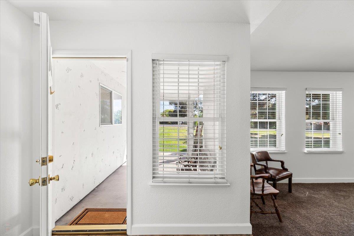 185 East Wyman Road French Camp, CA 95231 - Photo 7 of 44 a view of an entryway with wooden floor