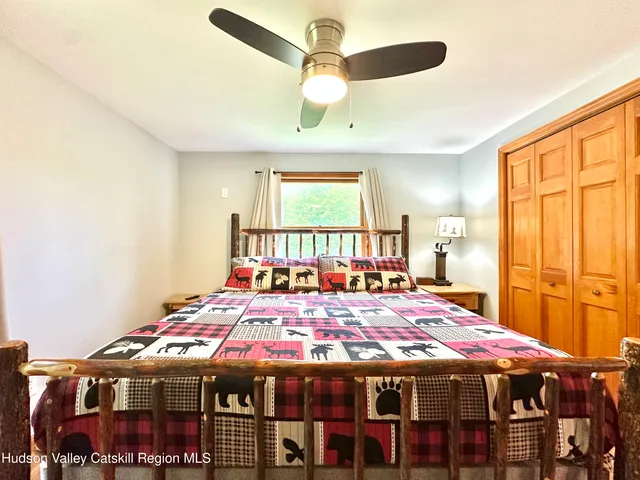 a large room with a bed and a chandelier