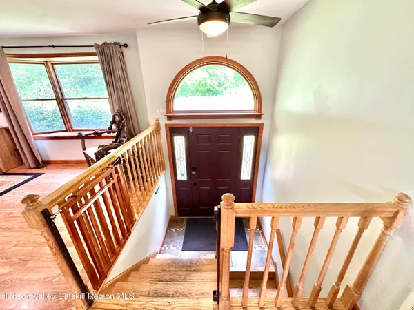 a view of an entryway door with a staircase
