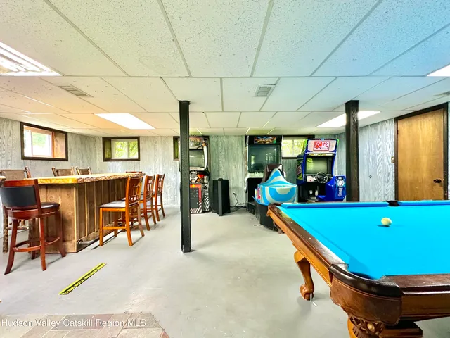 a room with lots of furniture and windows