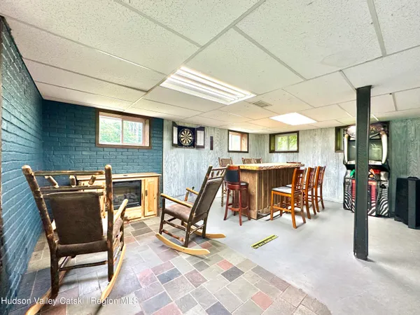 a view of a patio with table and chairs