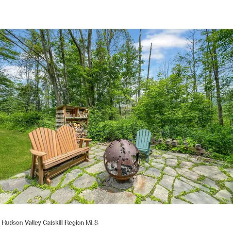 a view of a backyard with sitting area