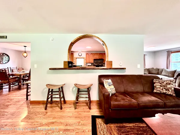 a living room with a couch and a dining table