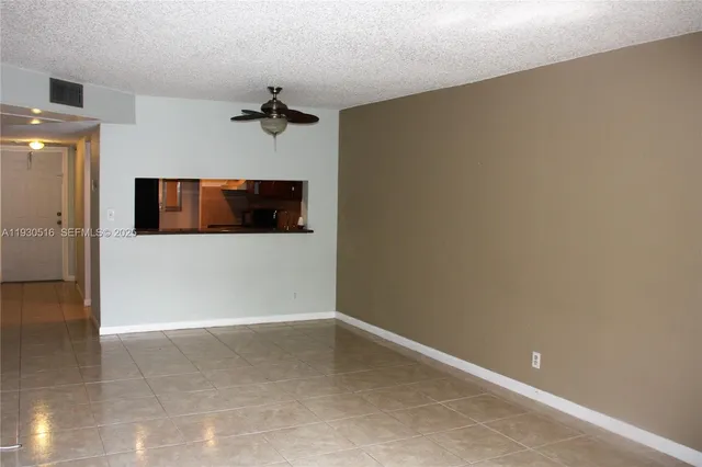 a view of a hallway with a microwave
