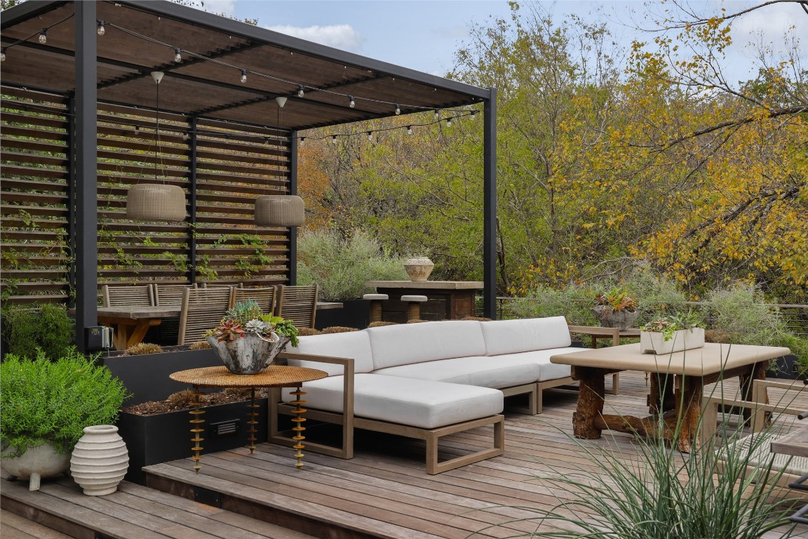 a outdoor living space with furniture and a potted plant