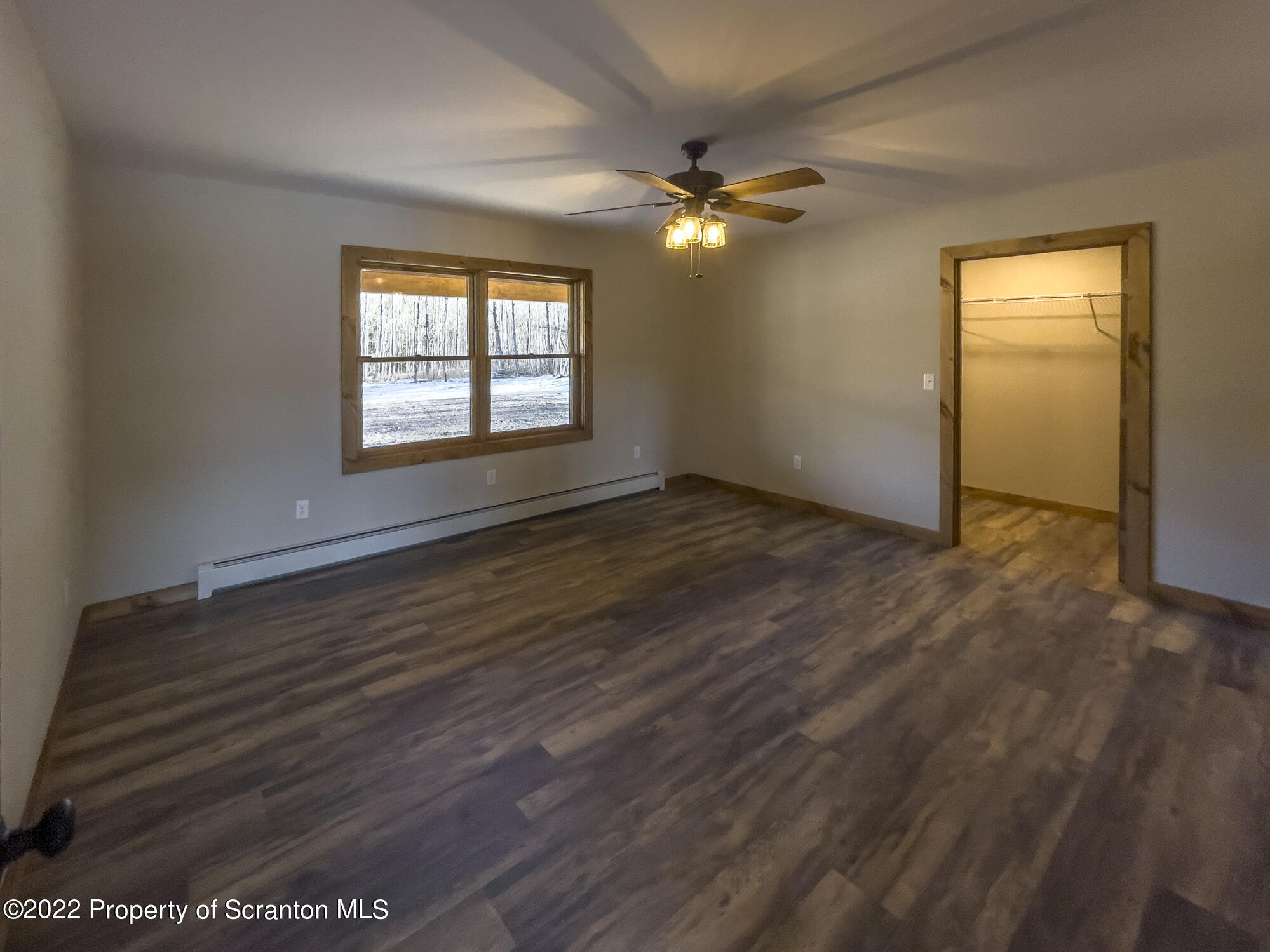311 Jubinsky Road Waymart, PA 18472 - Photo 12 of 89 a view of an empty room with window and wooden floor