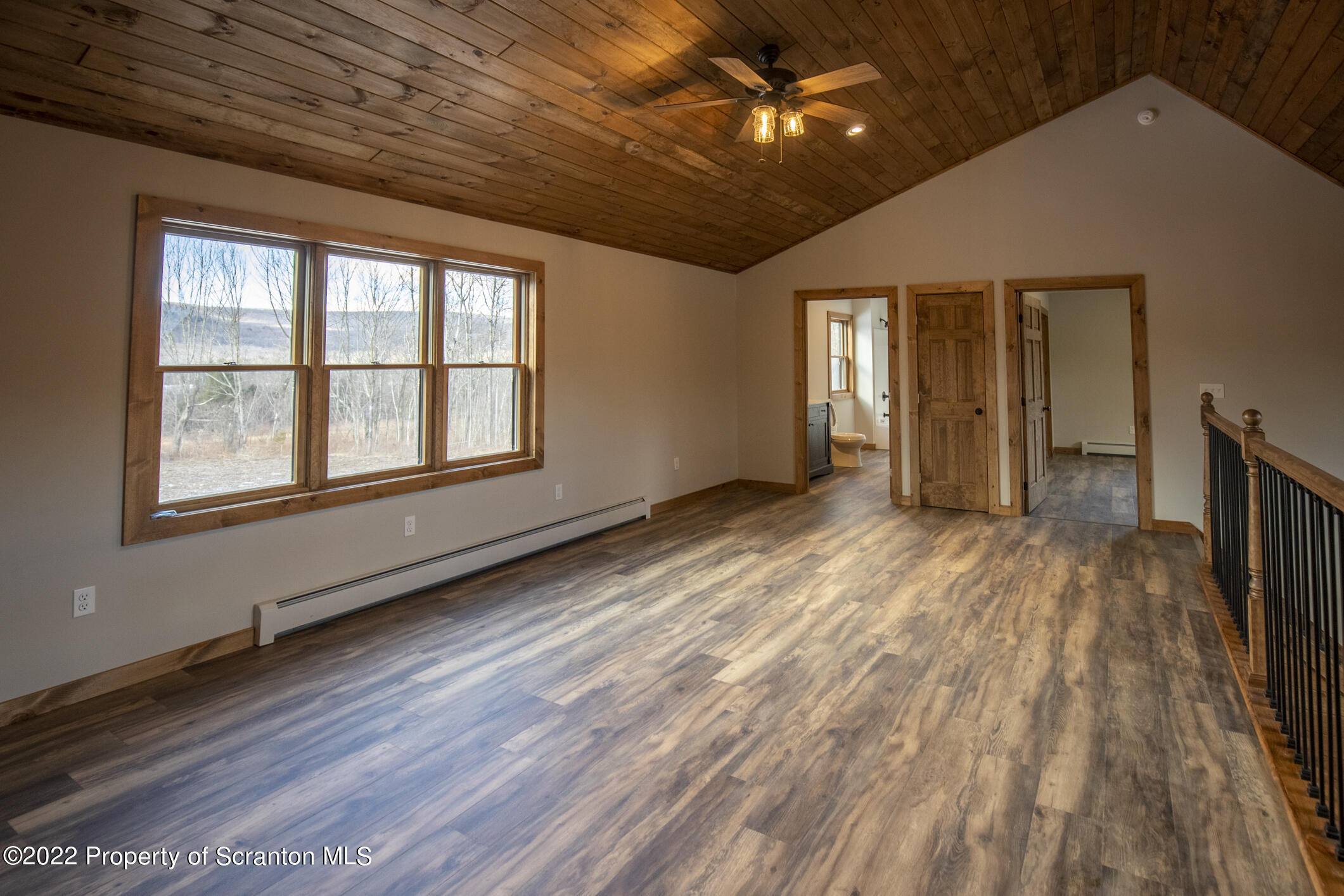 311 Jubinsky Road Waymart, PA 18472 - Photo 27 of 89 a view of an empty room with wooden floor and a window