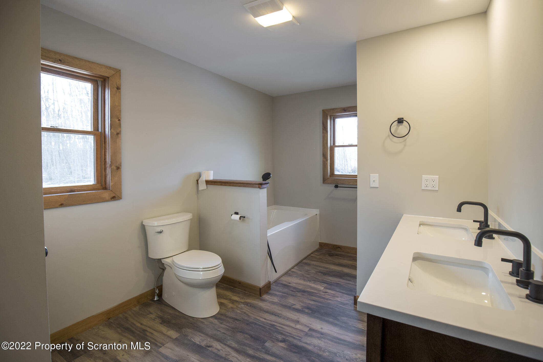 311 Jubinsky Road Waymart, PA 18472 - Photo 28 of 89 a bathroom with a sink toilet and a mirror