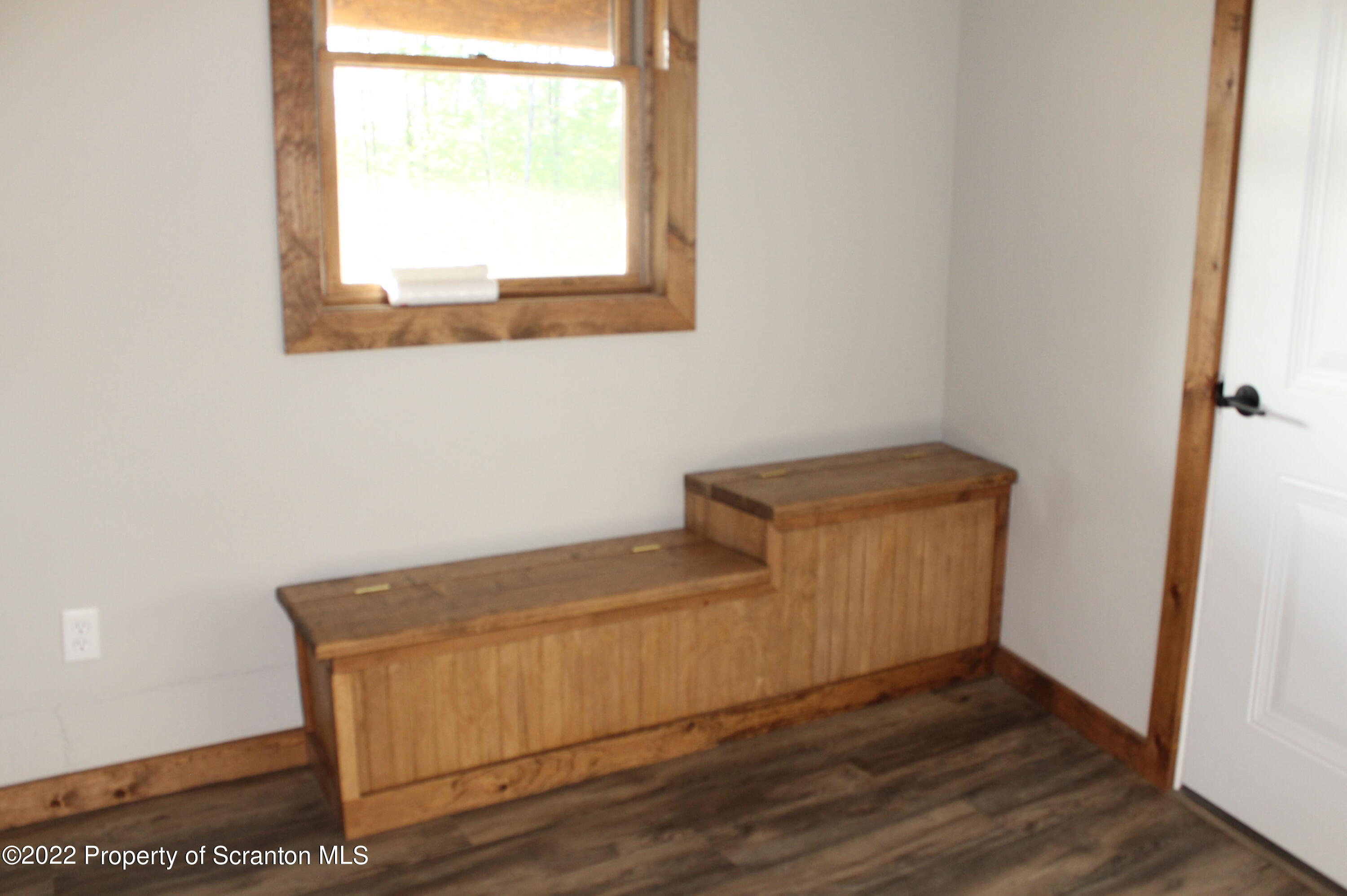 311 Jubinsky Road Waymart, PA 18472 - Photo 29 of 89 a room with a wooden floor and a window