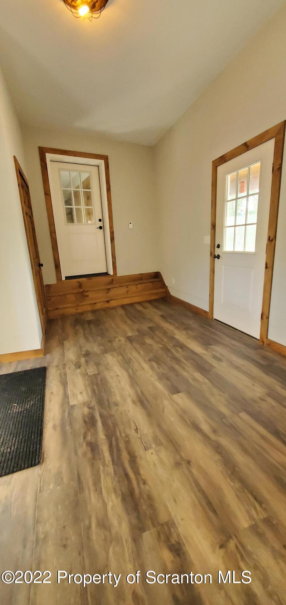311 Jubinsky Road Waymart, PA 18472 - Photo 30 of 89 a view of empty room with wooden floor