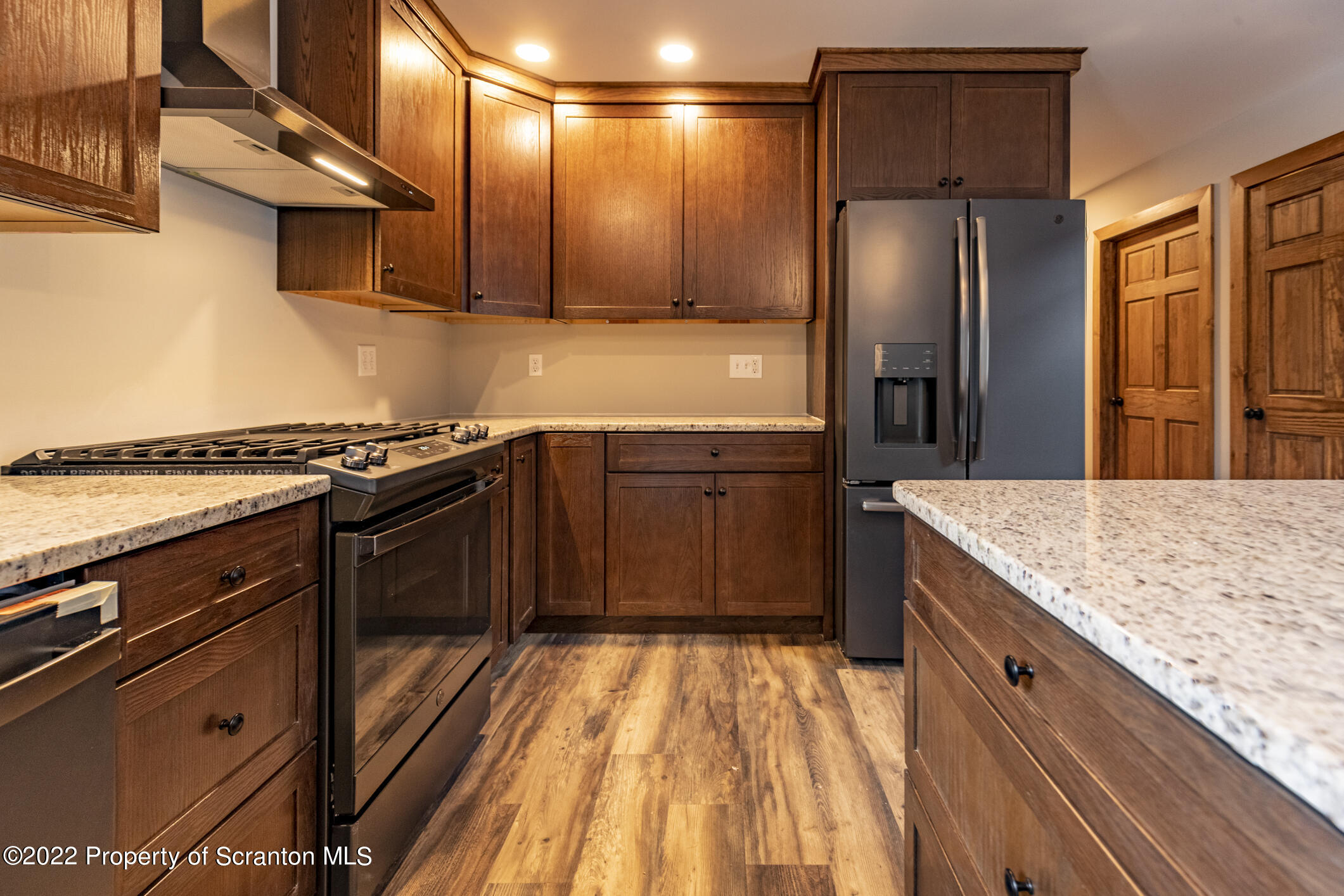 311 Jubinsky Road Waymart, PA 18472 - Photo 3 of 89 a kitchen with stainless steel appliances granite countertop a stove a refrigerator and a sink