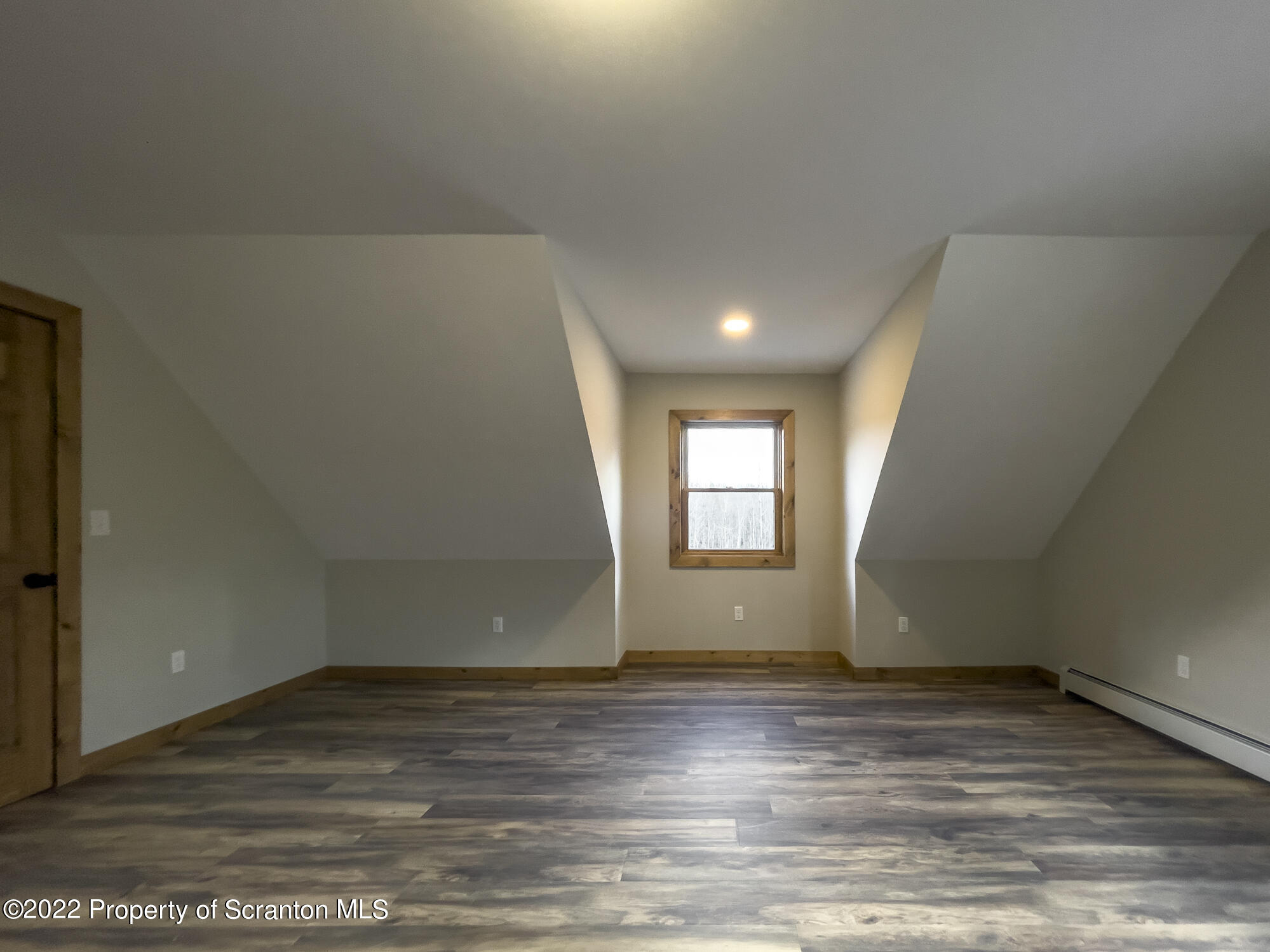 311 Jubinsky Road Waymart, PA 18472 - Photo 33 of 89 an empty room with wooden floor and windows