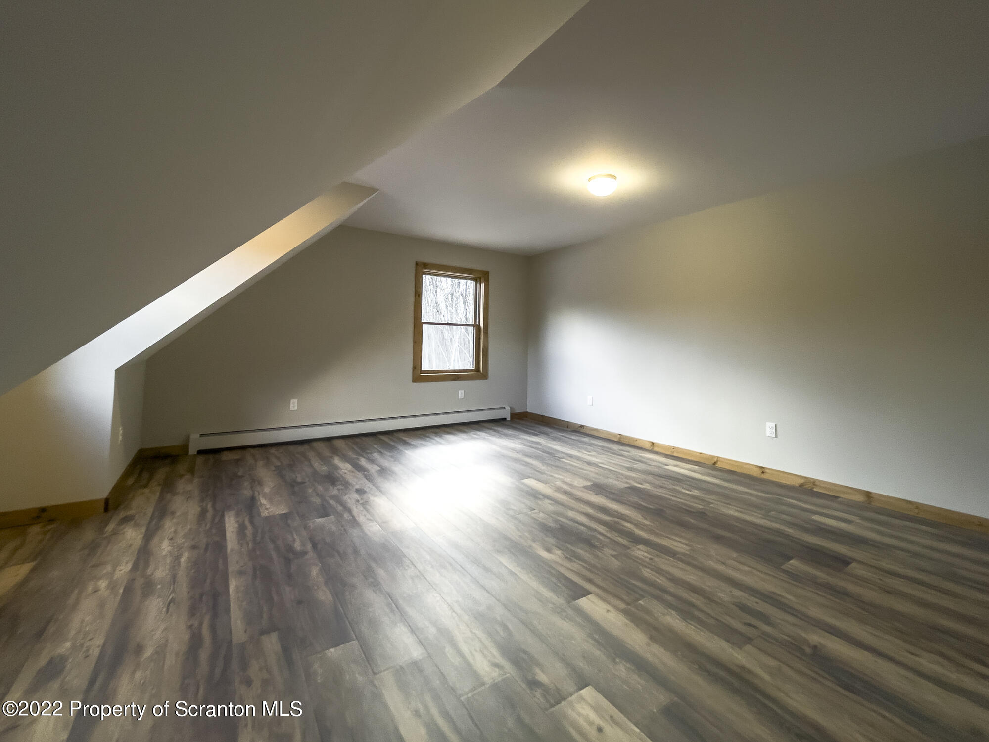 311 Jubinsky Road Waymart, PA 18472 - Photo 36 of 89 an empty room with wooden floor and windows