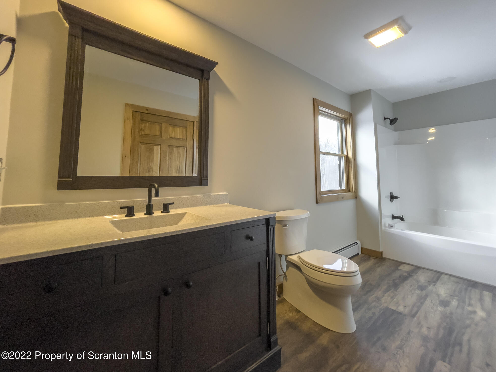 311 Jubinsky Road Waymart, PA 18472 - Photo 37 of 89 a bathroom with a toilet sink and mirror