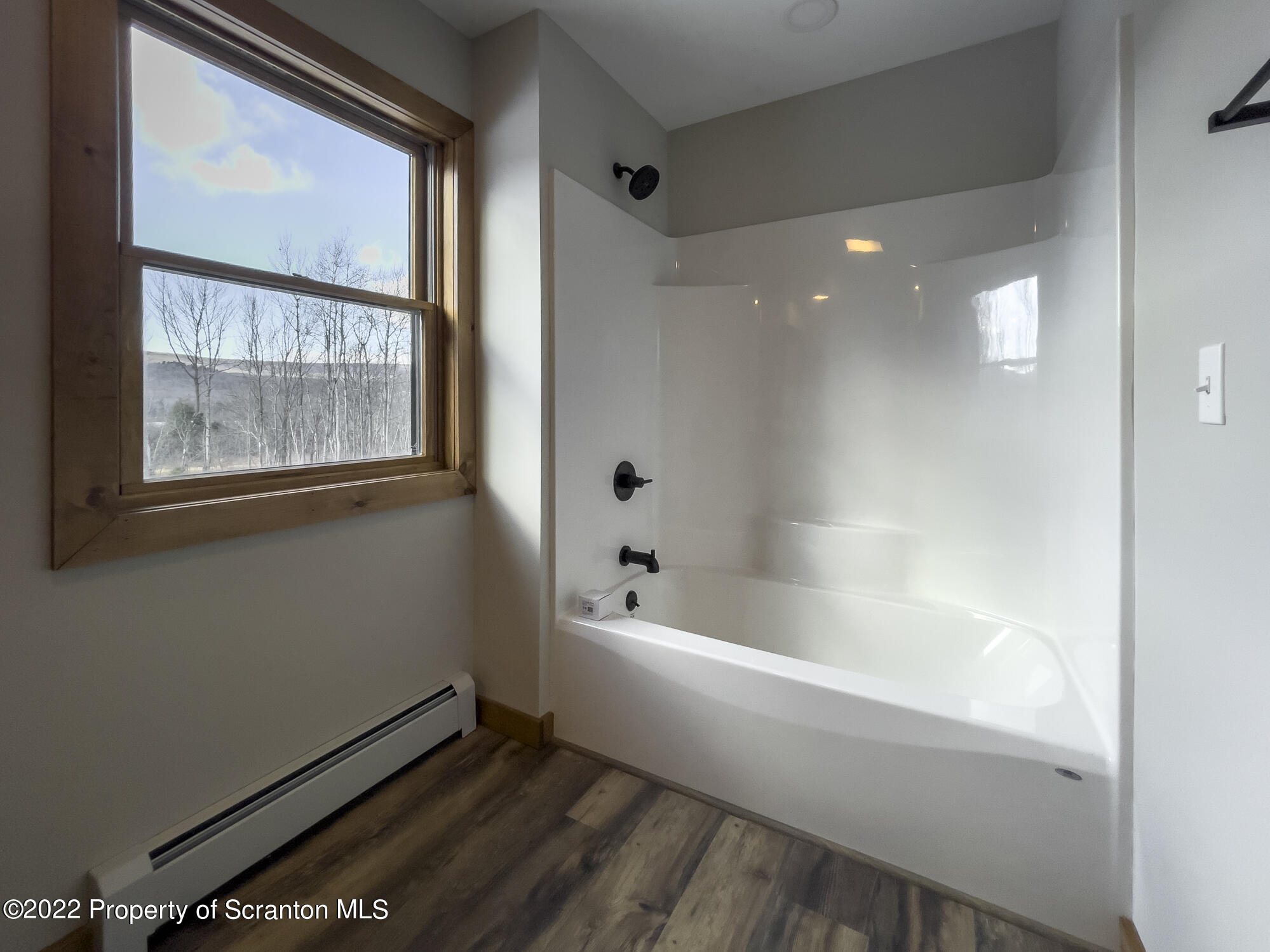 311 Jubinsky Road Waymart, PA 18472 - Photo 38 of 89 a bathroom with a bathtub and a window