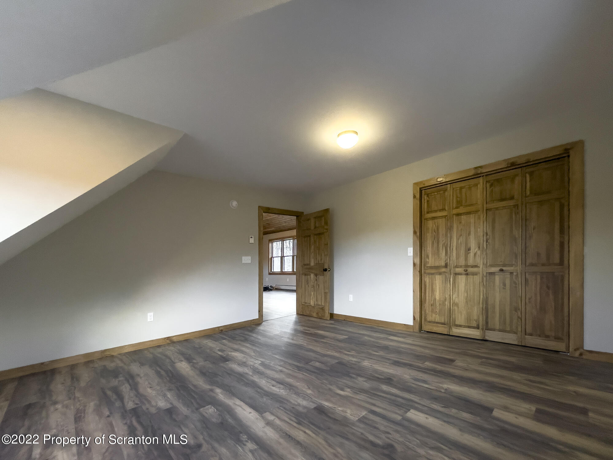 311 Jubinsky Road Waymart, PA 18472 - Photo 43 of 89 a view of empty room with wooden floor