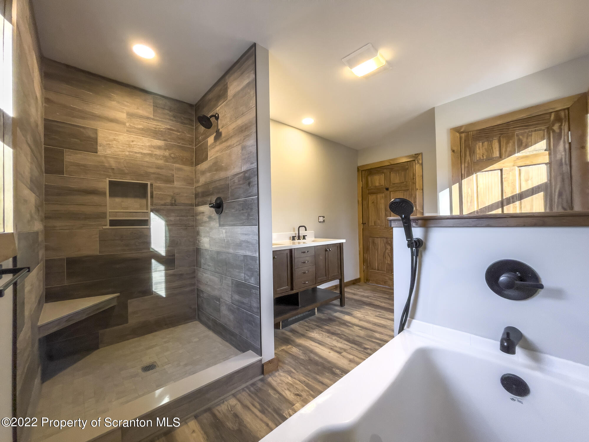 311 Jubinsky Road Waymart, PA 18472 - Photo 47 of 89 a bathroom with a shower a sink and a mirror
